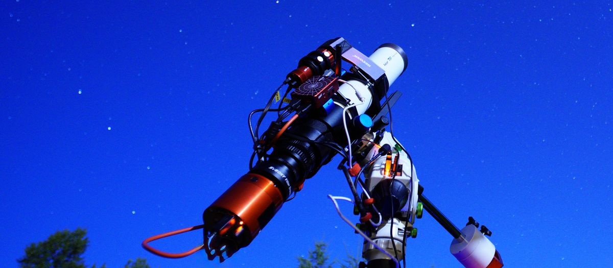 A sophisticated telescope pointing towards the starry night sky, perfect for astronomy enthusiasts.
