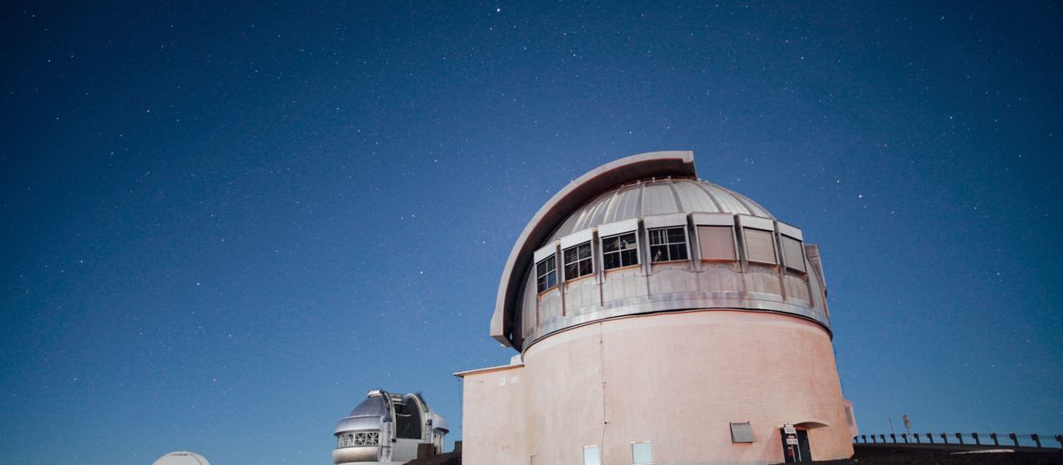 A stunning observatory under a clear, starry night sky, perfect for astronomy enthusiasts.